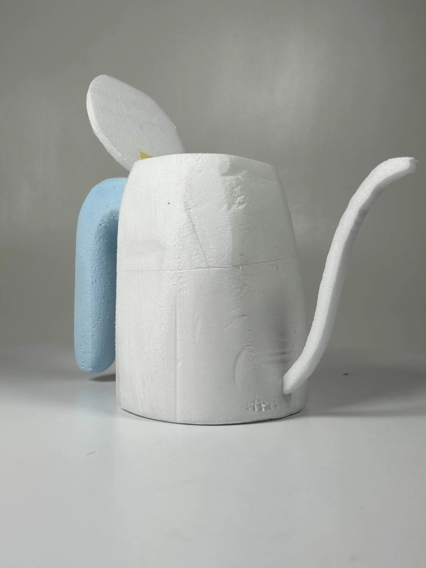 Refined foam model with a smoothed tapered body and a resolved handle profile.