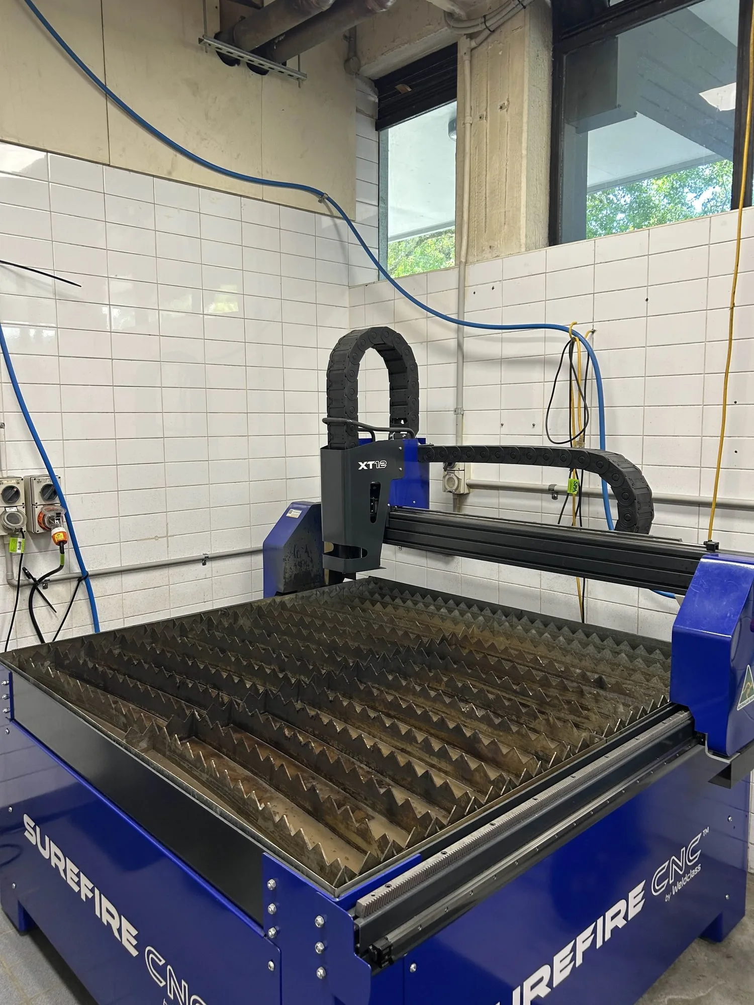The plasma cutting bed, the machine that failed on the aluminium.