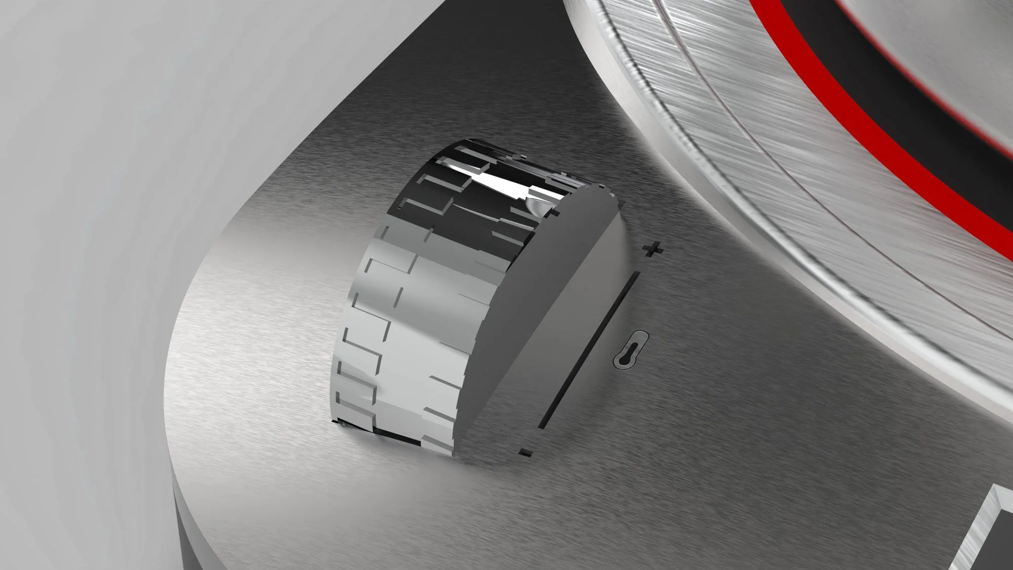The knurled steel temperature dial set into the brushed base, photographed close.